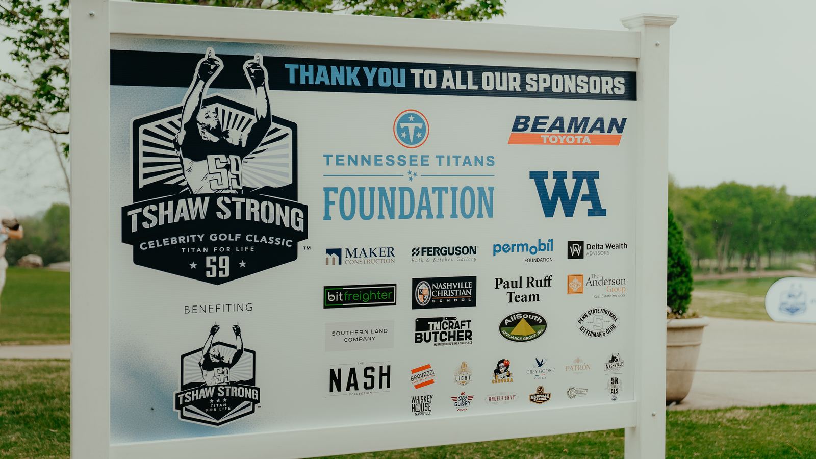 The sponsor board at the 2026 TShaw Strong Celebrity Golf Classic, headed &ldquo;Thank you to all our sponsors&rdquo;, carrying the Tennessee Titans Foundation, Beaman Toyota, Maker Construction, Ferguson, the Permobil Foundation and around twenty other logos.